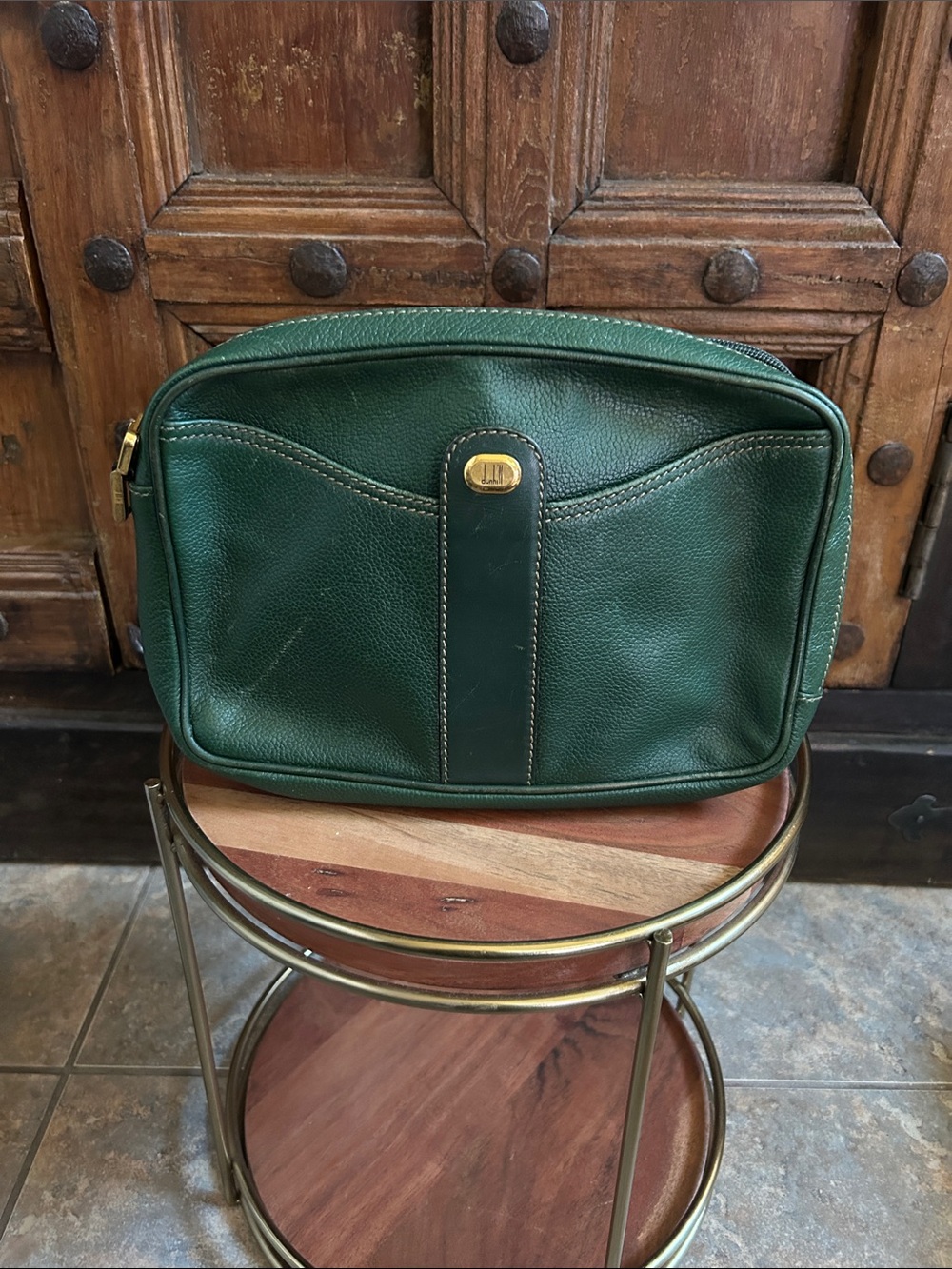 Dunhill vintage leather clutch bag. It green pebbled leather with gold accents